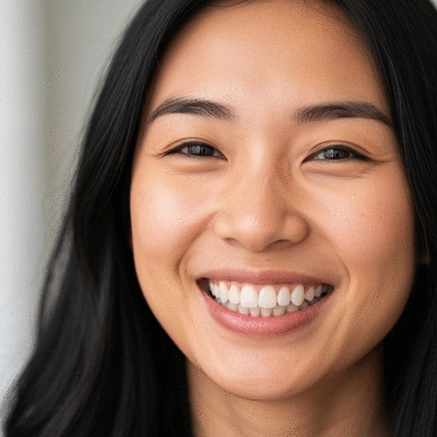 Smiling patient showing off results of dental bonding